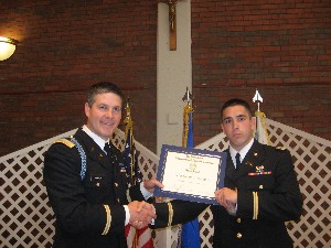 In May, Maj. Neal Gouck, USA (l), executive officer, Patriot Battalion ROTC, presents the chapter's award to Cadet James Gerardi, who  accepted the award on behalf of Cadet Timothy Swanton.